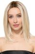 Woman in a past the shoulders platinum blonde lace front wig with long layers