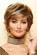 Woman in short, close cropped bob wig with medium brown hair, copper highlights, and side swept bangs