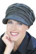 Woman wearing grey newsboy hat for cancer patients featuring multiple pleats