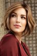 Woman in a past the chin warm brown wavy lace front bob wig