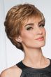 Woman in a dark blonde classic layered pixie wig with short choppy bangs