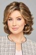 Woman in a chin length layered light brown lace front bob wig with side bangs