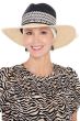 Woman in 2 tone summer fedora hat with brim, with headband underneath for cancer patients