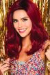 Woman in a long semi-wavy cranberry red wig