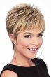 Woman in a layered blonde pixie wig with longer layers on top
