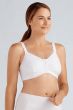 Woman in a white front closure bra for post surgery care