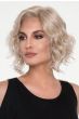 Woman in a shoulder length angled platinum blonde bob lace front wig