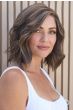 Woman in an auburn shoulder length blunt bob wig with curled under ends