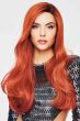 Woman in an extra long red wavy lace front wig