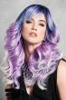 Woman in an extra long purple ombre curly wig with side bangs