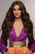 Woman in an extra long dark brown lace front curly wig