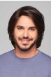 Man in a shoulder length dark brown human hair wig with shorter sides