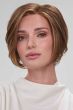 Woman in a chin length angled medium auburn lace front wig