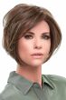 Woman in a large chin length medium brown angled lace front wig