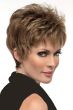 Woman in a choppy light brown pixie wig with fringe bangs