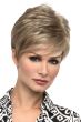Woman in an asymmetrical blonde wig with textured side bangs