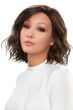 Woman in a petite shoulder length curly dark auburn lace front wig