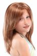 Young girl in a long, textured children's wig with face framing layers