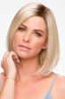 Woman in a petite shoulder length blunt cut light blonde wig