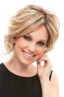 Woman in a chin length curly blonde angled lace front bob wig