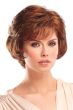 Woman in short to chin length red wavy wig with bangs and layers