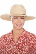 Woman in summer straw extra wide brimmed fedora hat with wide headband underneath for cancer patients