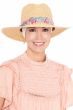 Woman in wide brim fedora hat with floral band accents for women, with headband underneath for cancer patients