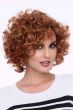 Woman in a past the chin medium red curly layered bob wig
