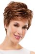 Woman in an auburn pixie wig with feathered layers and short fringe bangs