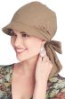 Woman in khaki colored brimmed cancer scarf with embroidery