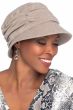 Woman in brimmed UPF cotton sun hat for cancer patients with visor in front