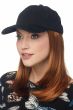 Woman in a black baseball cap with long straight hair attached