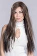 Woman in an extra long dark brown lace front straight wig with long layers