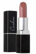Neutral soft pink lanolin lipstick in black container