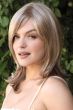 Woman in a past the shoulders light blonde lace front wig
