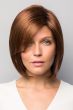 Woman in light auburn face framing bob wig with light layering along the face