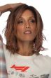 Woman in a shoulder length light blonde wavy lace front wig
