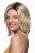Woman in a shoulder length light blonde wavy lace front wig