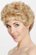 Woman in a short curly warm blonde wig