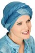 Woman in long blue head scarf wrapped into a head covering made of mesh fabric