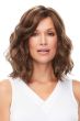 Woman in a petite shoulder length medium brown wavy lace front wig