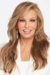 Raquel Welch in an extra long wavy light auburn wig with side bangs