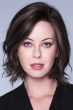 Woman in a dark brown chin length curly layered lace front bob wig