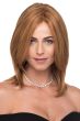 Woman in a shoulder length medium auburn straight human hair wig with face framing layers