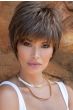 Woman in a brushed forward medium brown shaggy pixie wig with textured bangs
