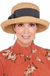 Woman in straw summer outdoor cloche sun hat with upturned brim and black bow