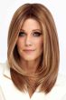 Woman in a past the shoulders light blonde straight lace front wig with long layers