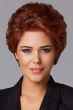 Woman in a copper red longer pixie bob wig with natural volume and a lace front