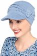Woman wearing light blue pleated hat for cancer patients