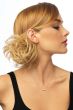Woman in a scrunchie with ginger blonde wavy hair attached